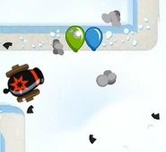 A bomb from a Bomb Tower sending off its shrapnel.