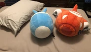 Another front view of BFB Plush with a pillow behind it