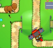 Monkey Ace with Neva-Miss Targeting upgrade hitting some Ceramic Bloons in Monkey Lane