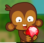 A monkey holding a mobile bloonstone from the bloonstones offer.