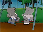 Alexander and Pom talking on the swings