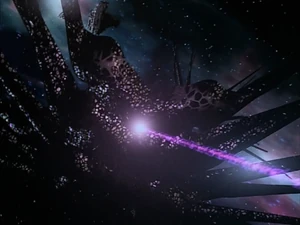 A Shadow Vessel firing its high-energy beam weapon.