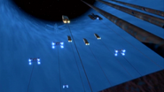 The artifact being towed out of hyperspace.