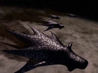 Shadow fighters release a nano-virus over a planet.