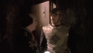 A prison guard within the Royal Palace being told to wall up the hallway and ignore the interred prisoner (Na'Toth) by Prime Minister Londo Mollari.