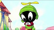 Baby Marvin fidgets his fingers after Baby Bugs tries to greet him.