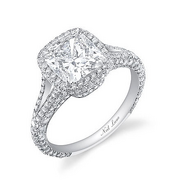 A 3.5-carat cushion cut by Neil Lane, set in a platinum band which is encrusted with more than 240 smaller diamonds.