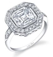 Grant & Lace A radiant-cut diamond in a hexagon-shaped double-halo setting.