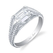 Demi & Kristian (Kristian's ring) Featuring an emerald-cut diamond set sideways in a highly stylized architectural design, the 2-carat platinum ring is further set with 48 smaller round diamonds made by Neil Lane.