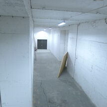 A Hallway Leading To A Exit
