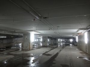 Backrooms Level 1 is a massive warehouse with concrete floors and