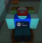 Ivan sitting down at his desk chair during the start of the game. (Old)