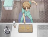 Akihisa preparing breakfast