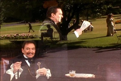 Pike watching Holmes on the street from a café window