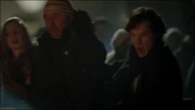 Sherlock rushes to save John from a bonfire.