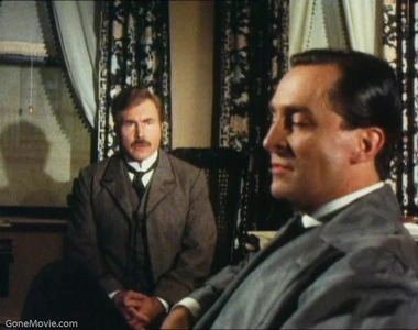 Sherlock Holmes (Jeremy Brett) tells Dr Watson (David Burke) he is excited because he received a letter from an unknown visitor