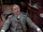 John Watson (Hardwicke) in armchair at 221B.png