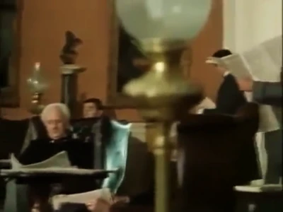Club members reading newspapers in one of the reading lounges