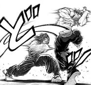 Musashi slashing through Retsu's midsection with his sword.