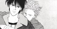 Ash stands behind Eiji