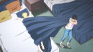 Eiji pulls Ash with the covers