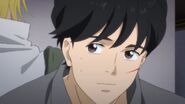 Eiji smiles at Ash back to back