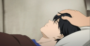 Shorter touches Eiji's head