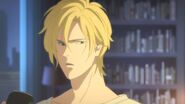 Ash looks back at Eiji after being asked a question