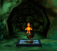 Kazooie opening the Orange Jinjo's cage in Terrydactyland.