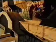 Banjo and Kazooie attempt to feathery flap around a large statue and onto the other side of the wall