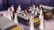 The girls listen to the story red out by Genevieve