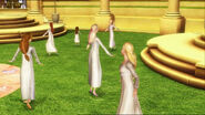 Hadley and Isla dance with Janessa at the back