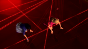 Isla and Blair dodge laser beams while Grace guides them.