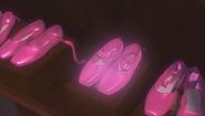 The pink shoes glows inside the cabinet