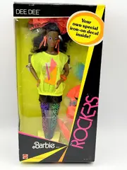 A 1980s era Black barbie doll with curly hair pulled back in a ponytail, which is held by a large, lacey, orange bow. She has purple eye makeup, pink-ish orange lipstick, and orange jewelry. SHe's wearing a bright yellow shirt with a pink and orange geometric graphic on it, as well as a short black skirt and multi-colored animal print leggings.