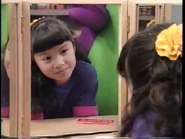 Min looking at herself in the mirror