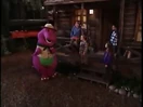 Barney and the children at a cabin.