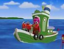 Barney and the children go sailing in a boat.