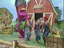 Barney and the children having fun on the farm.