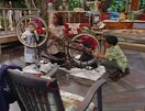 The children cleaning the bike of Robert's grandfather.