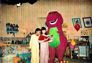 Behind the scenes shot of Min and Tosha reading to Barney