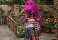 Laura hugging Barney along with David, and Tracy.