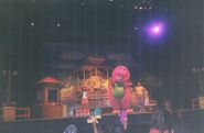 Barney and the kids on stage.