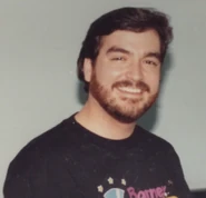 Dennis DeShazer wearing a Barney shirt