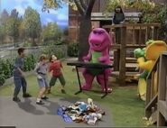 Everyone sings "Good Manners" around a pile of shoes.