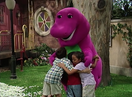 Barney and the children hug.