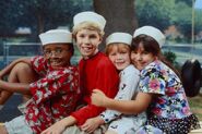 Promotional photo of (left to right) Derek, Michael, Kathy, and Tina pretending to be sailors.
