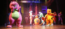 Barney and his friends doing the clapping movements in "The Clapping Song".