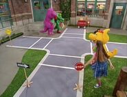 Barney teaches Baby Bop, BJ, and the kids about road safety.