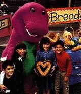 (Left to right) Juan, Min, Barney, Kathy and Carlos display the bread they made together.